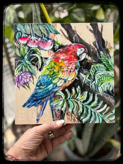 While watercolors are my first love, I enjoy exploring other mediums too. This vibrant macaw was painted with acrylics on a wood panel, which gives the colors a unique depth and texture. It shows a different side of my artistic expression.