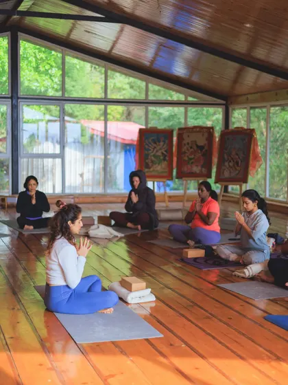 Leading a seated meditation with the group. Finding stillness together amplifies the collective energy and deepens our individual experience.