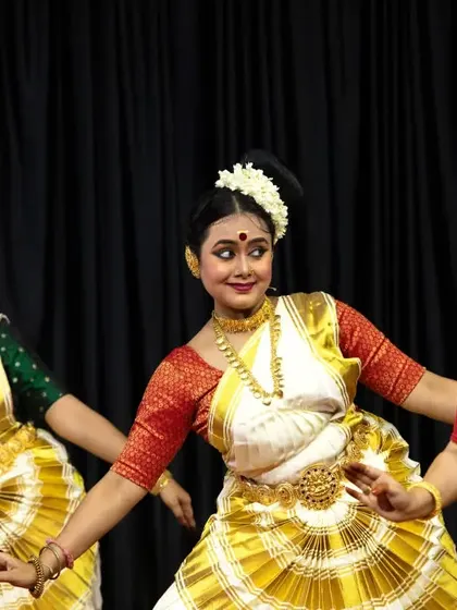 A close-up of our trio performance, focusing on the synchronized expressions and traditional attire.