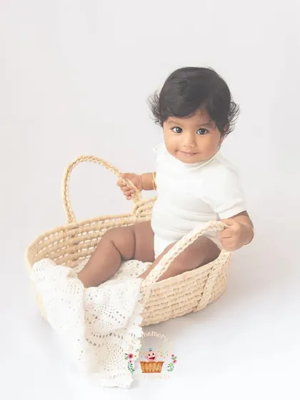 This little one looks so sweet sitting in this woven basket. Using simple, natural props can add a lovely texture and interest to the photos without being distracting.