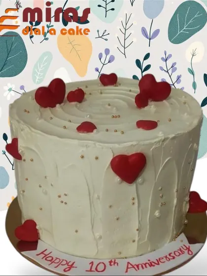 A lovely 10th-anniversary cake covered in red fondant hearts. This simple design is a beautiful and direct way to express love and celebrate a special milestone.