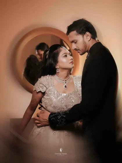 An intimate portrait of the couple, with the bride resting her head on the groom's shoulder.