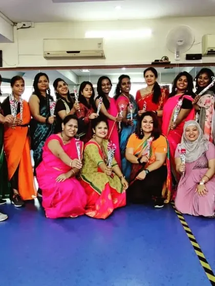 Our members dressed in beautiful sarees for Women's Day, each holding a rose. It was a colorful and heartfelt celebration of womanhood.