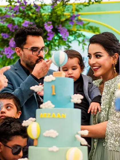 A sweet close-up of the birthday boy getting his first taste of cake. These are the precious, candid moments that make a first birthday so special.