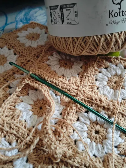 Something exciting is on the way. Working on a new piece with this lovely beige cotton yarn, creating daisy granny squares for a regular customer.