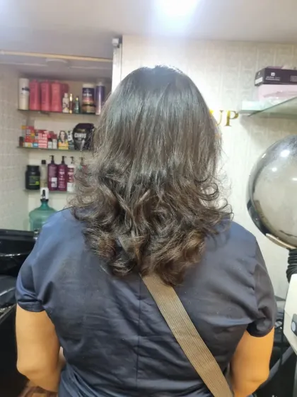 A gallery of finished haircuts, showing the beautiful layers and shape from the back. You can see the volume and texture each cut creates.