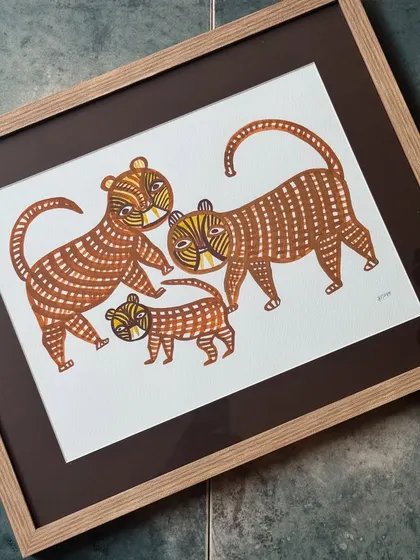 This framed Bhil art piece depicts a family of tigers, rendered in the traditional style with natural dyes. By bringing these pieces into our homes, we are not just decorating a wall; we are helping keep these art forms alive.