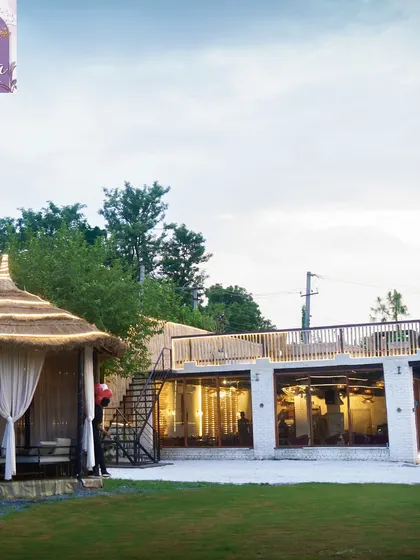 A view of the cafe and our rooftop seating area, with one of our private bamboo cabanas in the foreground.