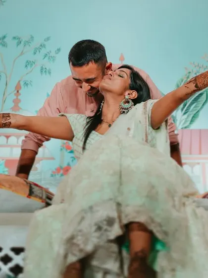 A joyful and uninhibited moment from a Mehendi party. We capture the carefree spirit and celebratory mood of the event.