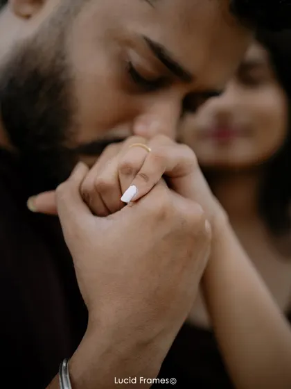 A classic, gentle kiss on the hand, a timeless gesture of romance that we love to capture.