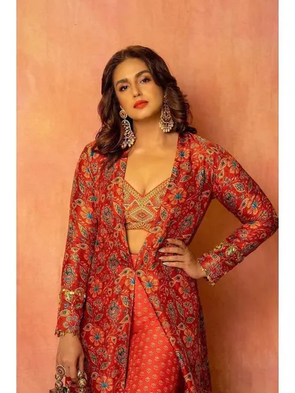 A powerful pose in the Label Anushree outfit. The long jacket over the crop top and pants is a modern way to wear traditional prints.