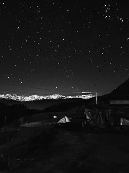 a starry night over a mountain hut. this image captures a sense of wonder and exploration, a feeling i aim to evoke in discovery-focused apps.