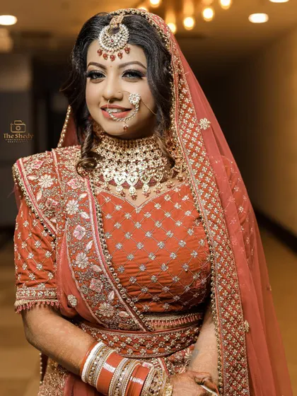 A happy and confident bridal portrait. The bride's bright smile shows her excitement for the day ahead.