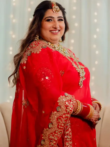 Another beautiful shot of this bride's reception look. Her smile is the centerpiece, enhanced by makeup that makes her skin look flawless and radiant.
