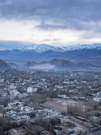 The city of Leh as seen from above during my winter trip. The entire valley is painted in muted winter tones, with the snow-capped Stok range looming in the distance.
