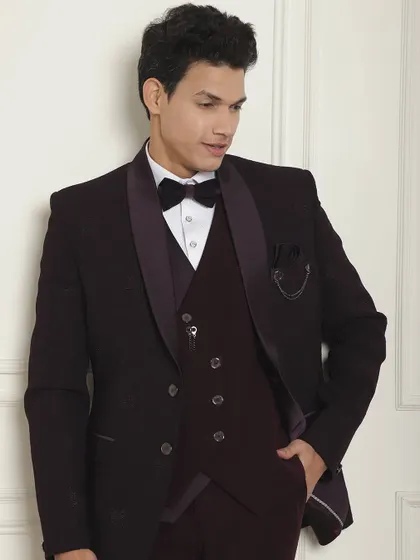 This deep wine-colored three-piece tuxedo is a stylish alternative to black, perfect for making a statement.