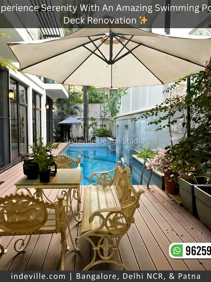 An ornate cast-iron bench and table set by the poolside. This choice of furniture adds a touch of classic elegance to the modern deck and pool area, creating a beautiful contrast.