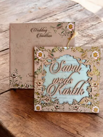 This rustic floral MDF laser-cut invitation has a beautiful, earthy feel. The design features a layered effect with a contrasting blue insert.