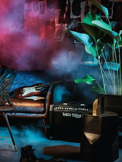 The Volta Sofa in a smoky, atmospheric setting. This piece is for the connoisseur who appreciates furniture that is not just functional but also a bold work of art.