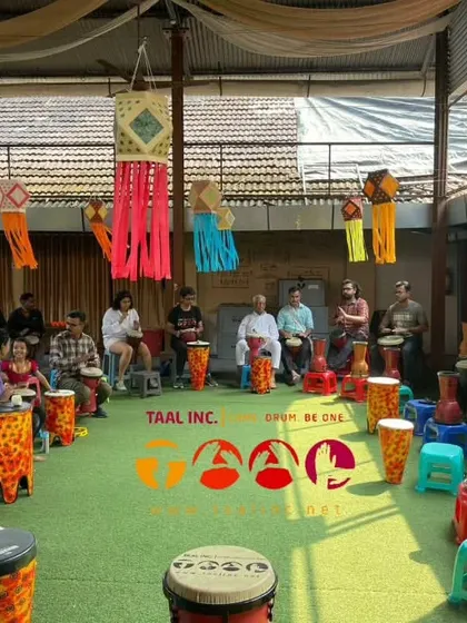 A festive community drum circle decorated with lanterns for Dhanteras. It's a beautiful sight when the community comes together to celebrate and create rhythm during special occasions.
