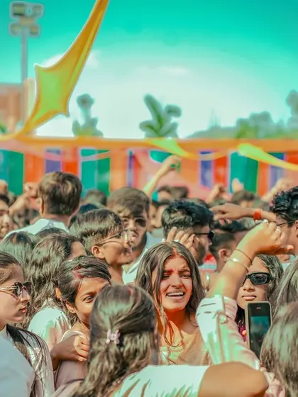 Interacting with fans in the crowd during the Holi party in Ranchi.