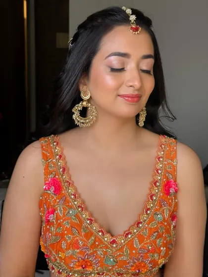 With eyes closed, you can see the soft, shimmery eyeshadow. It adds a touch of glam without being too heavy for a daytime event.