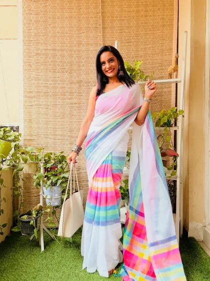I love the rainbow stripes on this white cotton mulmul saree. It's such a happy and cheerful piece, perfect for brightening up any day.