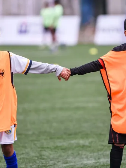The bond of teamwork is strong, even at the youngest ages.