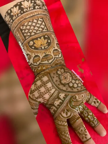 An intricate design with a mix of floral, lotus, and elephant motifs. The checkered pattern adds a beautiful texture to the overall look.