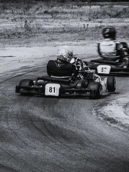 A black and white shot of our drivers cornering, highlighting the raw action of the sport.