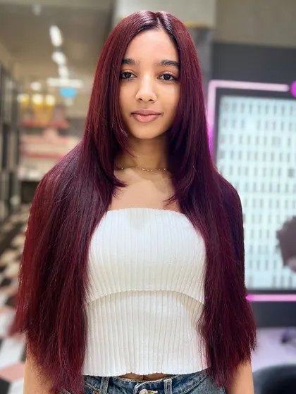 A front view of the gorgeous, long red hair. The color is uniform and rich, making a powerful and beautiful statement.
