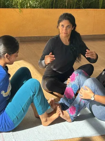 Guiding students in partner exercises helps them understand the mechanics of a pose. This interaction is from a workshop where we focused on using a partner's support to find stability and alignment.