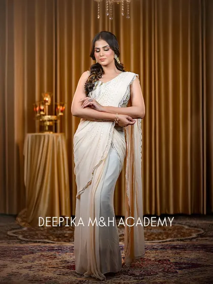 A full-length shot of the model in a modern, pre-draped saree. The style is chic and contemporary, perfect for a fashion-forward client.