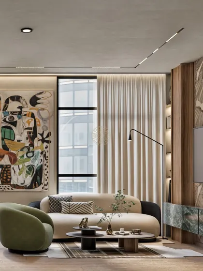 This cabin's lounge area uses a curved sofa, a sculptural green armchair, and a mix of coffee tables to create a dynamic yet harmonious composition. The design is perfect for a leader who values both style and comfort in their personal workspace.