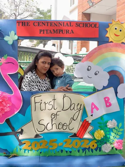 A mother and child capturing a sweet memory on the first day of school. These moments are precious, and we are here to support both children and parents as they begin their journey with us.