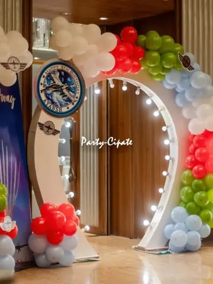 The entrance to the fighter jet party. A lit-up arch and a welcome sign with an aviation theme set the stage for an high-flying adventure.