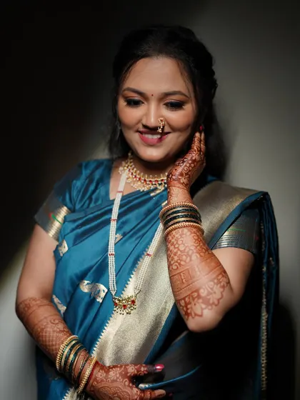 A beautiful portrait of Shivali. The lighting highlights the smooth, flawless finish of her makeup and the soft definition of her eyes and lips.