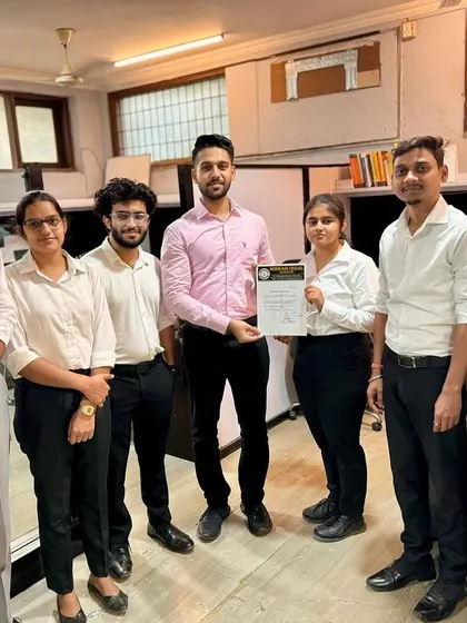 The full team congratulating another successful intern. This demonstrates the supportive and celebratory culture that is a core part of the Nirwan Legal experience.