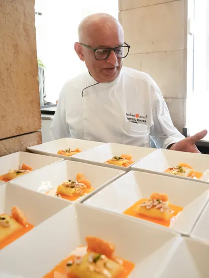Chef Shantanu Mehrotra oversees the plating of our take on the classic malpua. Soft as a sigh and soaked in citrus, it delicately balances Indian indulgence with French restraint.