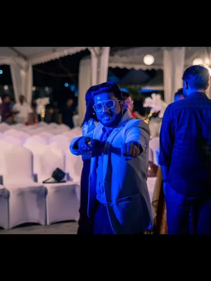 Another candid moment, captured in the blue light of the dance floor.