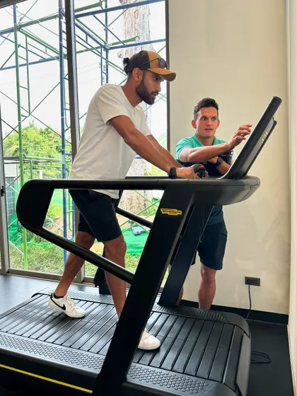 Assessing an athlete on the treadmill at the high-performance center in Thailand.