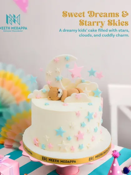 Sweet dreams and starry skies. This dreamy kids' cake features a cuddly teddy bear sleeping on a crescent moon among pastel stars.