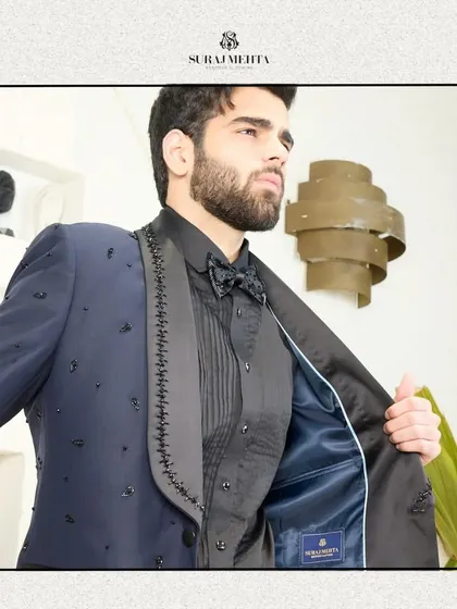 A glimpse of the fine interior lining of the navy blue tuxedo. My commitment to quality is evident inside and out, with a smooth satin lining ensuring comfort and a perfect drape.