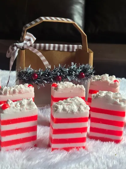 A festive collection of my red and white striped Christmas soaps, ready to be packed into gift baskets. These are made with a gentle, paraben-free base.