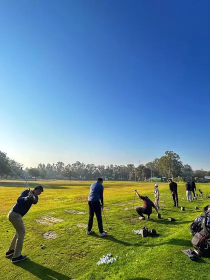 A perfect day for golf, with clear blue skies and a range full of enthusiastic players.