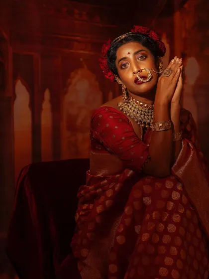 Another angle of this dramatic festive look, showing the beautiful details of the saree and jewellery.