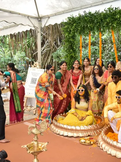 A beautiful, candid moment of the bride and groom being showered with flower petals by their loved ones.