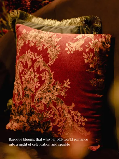 For the sangeet, the cushions were chosen to match the dramatic mood. This baroque-style velvet cushion in deep red added a touch of old-world romance and luxury to the seating.