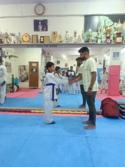 A handshake for a new blue belt.