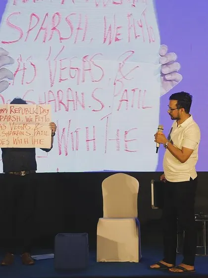 A volunteer holds up a small sign while I hold up a giant one with the same message. This is a prediction routine with a comedic twist that I customize for each client.